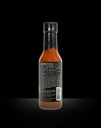 Bottle of Lovejoy's Burn Yo Face Hot Sauce with side view of label including Nutrition Facts.